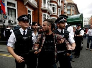 Assange sees end to standoff within year