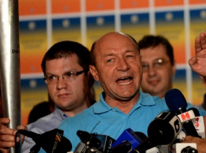 Romania's president keeps his job, court rules